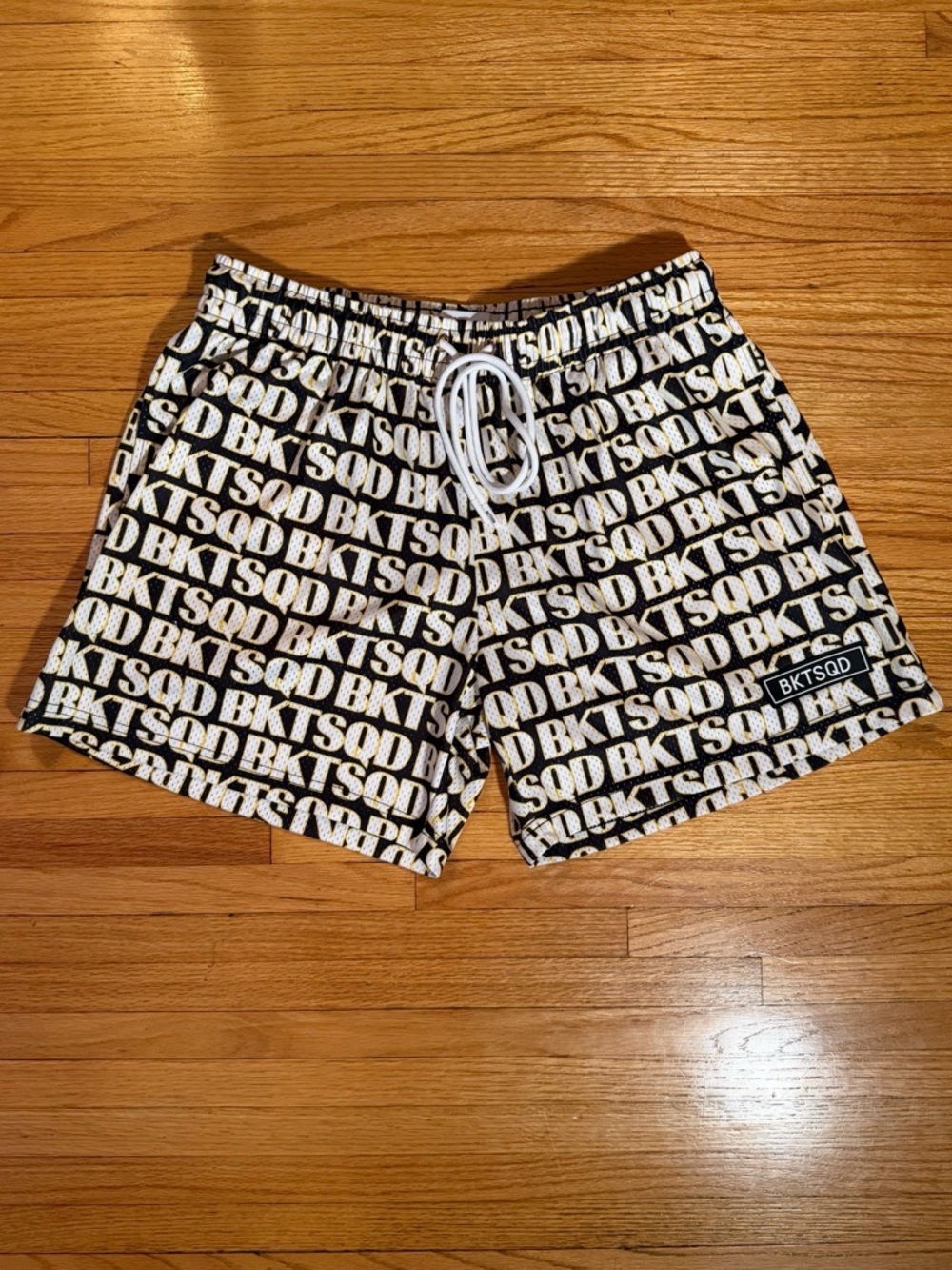 BKTSQD Black & White Logo Repeat Shorts
